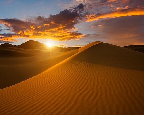 A vibrant marketplace in Morocco with colorful spices and textiles